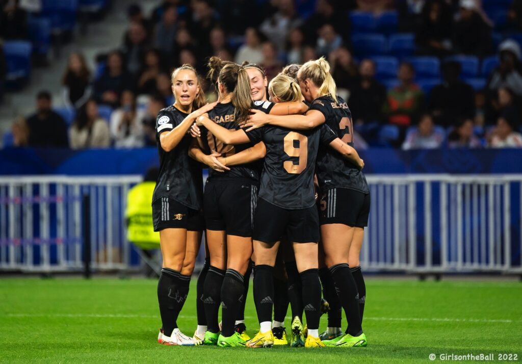 Arsenal celebrate against Lyon in the Champions League