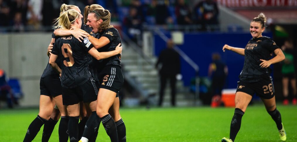 Arsenal celebrate against Lyon in the Champions League