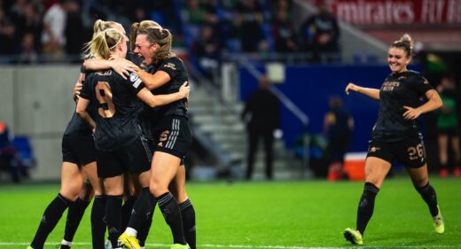 Arsenal celebrate against Lyon in the Champions League