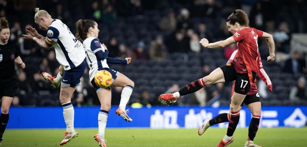 Dominqiue Janssen strikes the ball as Manchester United take on Tottenham in the Barclays WSL