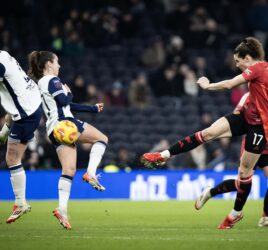 Dominqiue Janssen strikes the ball as Manchester United take on Tottenham in the Barclays WSL